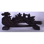 A LARGE CHINESE HARDWOOD FIGURAL GROUP OR STATUE, in the form of figures upon a fruiting carving. 58