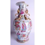 A 19TH CENTURY CHINESE CANTON FAMILLE ROSE PORCELAIN VASE painted with figures within landscapes. 43