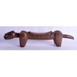 AN UNUSUAL EARLY 20TH CENTURY AFRICAN TRIBAL CARVED WOOD HEAD REST in the form of a stylised animal.