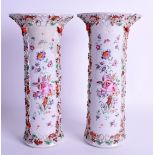 A PAIR OF 18TH CENTURY CHINESE FAMILLE ROSE TRUMPED SHAPED VASES Qianlong, painted with floral spray