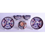 A PAIR OF 18TH CENTURY JAPANESE EDO PERIOD IMARI BOWLS AND SAUCERS one with cover, painted with land