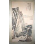 AN EARLY 20TH CENTURY CHINESE SCROLL decorated with a seated scholar within a landscape. Image 88 cm