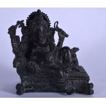 AN 18TH/19TH CENTURY INDIAN BRONZE STATUE OR BUDDHA OF GANESHA, modelled seated upon a throne holdin