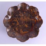 A 19TH CENTURY JAPANESE MEIJI PERIOD LACQUERED TORTOISESHELL DISH decorated with an exotic bird with