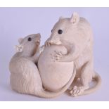 A GOOD 19TH CENTURY JAPANESE MEIJI PERIOD CARVED IVORY OKIMONO modelled as two rats upon a ball. 10