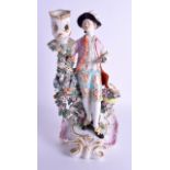 AN 18TH CENTURY DERBY FIGURE OF A GALLANT modelled as a candlestick, wearing a pink jacket. 28 cm hi