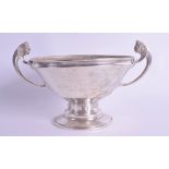 AN ART DECO TWIN HANDLED SILVER GOLF TROPHY presented to Mrs T S Baker May 29th 1934. London 1933. 1