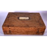 AN ANTIQUE WOODEN BOX, inset with bronze cartouche "Standard Life Assurance Coy Doune". 44 cm wide.