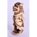 AN UNUSUAL 19TH CENTURY JAPANESE MEIJI PERIOD STAG ANTLER NETSUKE modelled as a buddhistic lion. 5.7