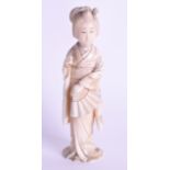 A 19TH CENTURY JAPANESE MEIJI PERIOD CARVED IVORY OKIMONO modelled as a female wearing foliate robes