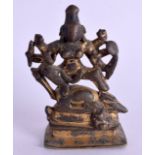 A SMALL 16TH/17TH CENTURY INDIAN BRONZE FIGURE OF A BUDDHIST DEITY modelled upon a rectangular base.