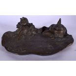 AFTER HENRYK KOSSOWSKI (1855-1921), a bronze inkwell, formed with a bathing female. 22.5 cm wide.