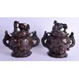 A RARE PAIR OF 19TH CENTURY JAPANESE MEIJI PERIOD BRONZE BOWLS AND COVERS decorated in relief with i