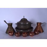 AN ISLAMIC COPPER BOWL AND COVER, together with assorted Eastern copper items. Largest 22.5 cm wide.