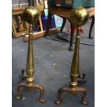 A PAIR OF EARLY 20TH CENTURY BRASS ANDIRONS, formed with spherical top. 58 cm high.