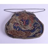A RARE 18TH CENTURY JAPANESE EDO PERIOD SILK PURSE decorated with a dragon, with white metal dragon