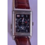 A FINE 18CT WHITE GOLD JAEGER LECOULTRE REVERSO WRISTWATCH with black dial, calendar & night/day ape