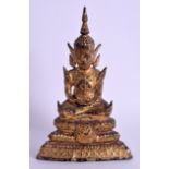 A 19TH CENTURY SOUTH EAST ASIAN GILDED BRONZE BUDDHA modelled upon a stepped triangular base. 16 cm