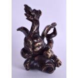 A GOOD EARLY 18TH CENTURY EUROPEAN BRONZE FIGURE OF A GROTESQUE BIRD modelled emerging upon a scroll