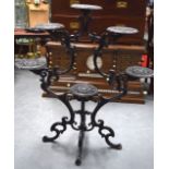 A VICTORIAN SIX BRANCH CAST IRON PLANT STAND, of scrolling design with pierced holders. 101 cm x 91