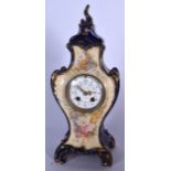 AN EARLY 20TH CENTURY SCOTTISH PORCELAIN MANTLE CLOCK BY J A PATERSON, formed with scrolling feet an