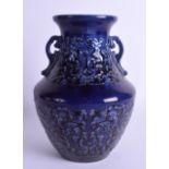 A 19TH CENTURY CHINESE AUBERGINE TWIN HANDLED VASE bearing Qianlong marks to base, decorated with ta