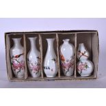 A SET OF FIVE CHINESE EGGSHELL PORCELAIN VASES, painted with birds and foliage, varying shape. Large