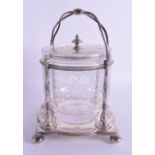 A LATE VICTORIAN/EDWARDIAN SILVER PLATED ENGRAVED GLASS BISCUIT BARREL decorated with foliage and vi