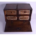 A 17TH CENTURY CONTINENTAL CARVED WOOD FALL FRONT TABLE CABINET with lozenge shaped decoration to th