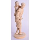 A 19TH CENTURY JAPANESE MEIJI PERIOD CARVED IVORY OKIMONO modelled as a male with a child upon his b