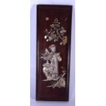 A CHINESE HARD WOODEN PANEL OR PLAQUE, inlaid with mother of pearl depicting a female beside a vase.