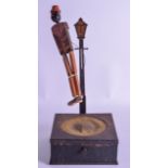 A VERY RARE EARLY 20TH CENTURY AMERICAN CAST IRON SPEAKER with dancing articulated wooden man to the