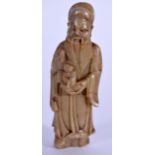 AN EARLY 20TH CENTURY CHINESE CARVED SOAPSTONE STATUE OF AN IMMORTAL, formed standing holding a chil