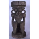 A WOODEN TRIBAL FIGURAL STOOL, possibly the Aztec bird god "Quetzalcoatl", formed upon a circular pl