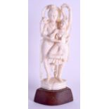 A 19TH CENTURY ANGLO INDIAN CARVED IVORY FIGURE OF A DANCING COUPLE modelled in an embrace. Ivory 14
