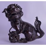 A 17TH/18TH CENTURY CHINESE BRONZE CENSER AND COVER Ming, depicting a buddhistic lion its leg upon a