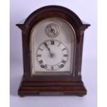 AN ANTIQUE MAHOGANY MANTEL CLOCK with silvered dial. 23 cm x 15 cm.