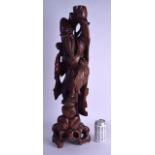 A VERY LARGE 19TH CENTURY CHINESE CARVED ROOTWOOD FIGURE OF AN IMMORTAL modelled holding aloft a fru