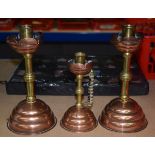 A PAIR OF BENSON COPPER AND BRASS CANDLESTICKS, together with a smaller example. 23 cm high.