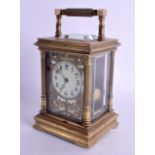 A 19TH CENTURY FRENCH BRASS REPEATING CARRIAGE CLOCK with openwork foliate dial. 18.5 cm high inc ha