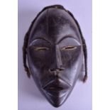 A 19TH CENTURY AFRICAN TRIBAL CARVED WOOD MASK modelled as a male with scowling teeth. 28 cm x 18 cm
