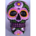 AN UNUSUAL ABSTRACT DAMIEN HIRST INSPIRED MODEL OR SCULPTURE OF A SKULL, decorated with pink flowers