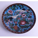 A 19TH CENTURY JAPANESE MEIJI PERIOD CLOISONNE ENAMEL DISH decorated with birds in flight. 30 cm dia