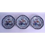 A SET OF THREE 18TH CENTURY CHINESE EXPORT PLATES Qianlong, painted with flowers behind a fenced gar