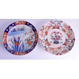 TWO 19TH CENTURY JAPANESE MEIJI PERIOD IMARI DISHES painted with flowers. 30 cm wide.