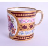 A 19TH CENTURY SEVRES STYLE PORCELAIN MUG painted with floral sprays upon a dark ground. 7.5 cm high