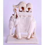 A 19TH CENTURY INDIAN CARVED IVORY FIGURE OF AN ELEPHANT modelled upon a rectangular base. 10 cm x 7