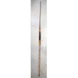 AN ANTIQUE SPEAR, formed with a part wooden shaft. 170 cm long.
