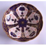 A ROYAL CROWN DERBY IMARI SCALLOPED BOWL painted with flowers. 18 cm wide.