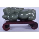 AN EARLY 20TH CENTURY CHINESE GREEN JADE CARVED STATUE OR FIGURE OF A MYTHICAL BEAST, modelled recum